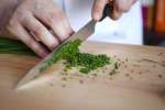 chef slicing chives Shot