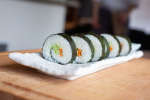 sushi rolls with rice carrots and cucumbers Shot