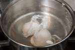 poaching two eggs in hot water Shot