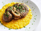 Cooking Class - Dinner Alla Milanese in Downtown Dallas: Osso buco served over creamy polenta with lemon zest and parsley garnish.
