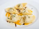 Cooking Class - Stuffed Pasta Made Fresh in Downtown Dallas: Plate of handmade pumpkin agnolotti garnished with sage and brown butter.