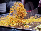 Hibachi Catering - Live Hibachi Feast: cooking fried rice on hibachi grill
