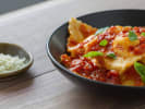 Cooking Class - Pasta Focus: Homemade Ravioli in South Bay & Peninsula: Three cheese ravioli with pancetta and tomato sauce, served with shredded Parmesan.