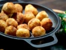 Cooking Class - Master Your Bistro Favorites in South Bay & Peninsula: Golden truffled pommes dauphine served in a cast iron skillet.