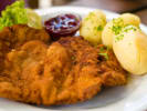 Cooking Class - Romantic Bavarian Feast - Date Night in South Bay & Peninsula: Classic pork schnitzel served with mashed potatoes, chive garnish, and lingonberry sauce.