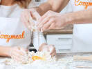 Cooking Class - Tuscan Steak Lovers - Date Night in Northern Suburbs: close up of a couple with Cozymeal aprons making pasta dough together