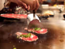 Hibachi Catering - Exclusive Hibachi Session: Hibachi chef cooking meat