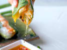 Cooking Class - Preparing Hearty Vegan Dishes: dipping summer rolls in sauce