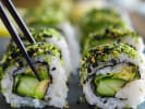 Cooking Class - Handcrafted Sushi - Date Night in Manhattan: Close-up of avocado and vegetable sushi rolls topped with sesame seeds, with chopsticks.