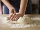 Cooking Class - Sweet Focaccia to Crispy Grissini in Downtown Dallas: Kneading bread dough by hand on a floured surface.