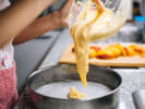 Cooking Class - A Taste of British Baking in Northern Suburbs: A baker pouring dough for pastry preparation