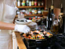 Cooking Class - Paella Making + Tapas Party - Private in San Francisco: A chef adding mussels to seafood paella