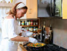 Cooking Class - Paella Making + Tapas Party - Private in San Francisco: A chef adding vegetables to paella