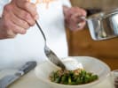 Cooking Class - Master the French Bistro in Northern Virginia: A chef plating an elegant gourmet dish