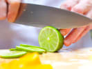 Cooking Class - Mexican Rendezvous - Date Night in Northern Virginia: A chef slicing fresh lime and mango for a vibrant dish
