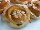 Cooking Class - Fresh-Baked Danish Delights in Northern Suburbs: A close up of freshly baked Danish pastries topped with almonds and icing