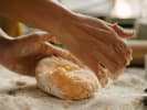 Cooking Class - Creative Croissant Selections in Manhattan: A person kneading dough for pastries on a flour dusted surface