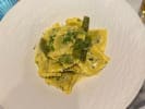 Cooking Class - Flavors of Tuscany in Carlsbad & Oceanside: Asparagus and pea ravioli delicately plated on a white plate
