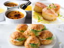 Cooking Class - Traditional Flavors of France in Northern Suburbs: Bastille Day Feast cooking class spread featuring French pastries – A wooden board with golden puff pastry bites, mini savory pastries, and elegant hors d'oeuvres, all arranged for a festive French-inspired meal.