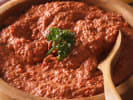 Cooking Class - Savory & Sweet Mediterranean Mezze: Bowl of smoky red pepper and walnut muhammara dip garnished with fresh herbs