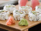 Cooking Class - Make Your Own Sushi: California sushi roll up lose on a dark rustic plate