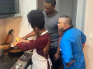 Team Building Cooking Class - Best of the Bayou in Manhattan: Chef and two participants cooking together at the stove