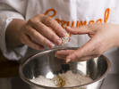 Online Couples Cooking Class - Traditional Italian Easter Pie: Chef coating homemade truffles