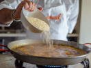 Team Building Cooking Class - Traditional Spanish Cuisine in Philadelphia: Chef cooking paella