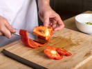 Cooking Class - Fundamentals of Asian Cuisine: Chef cutting peppers Cozymeal