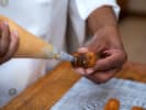 Cooking Class - The Art of French Pastry: Chef filling cream puffs