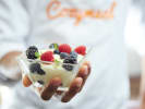 Cooking Class - Italian Pasta-Making Feast: Chef holding a glass cup of zabaglione with fresh berries