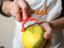 Team Building Cooking Class - Authentic Thai Meal in DC: Chef peeling fresh mango