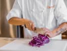 Online Cooking Class - Fried Vegan Avocado Street Tacos: Chef shredding cabbage