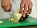 Couples Cooking Class - Persian Fare From Scratch: Chef slicing eggplant