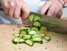 Cooking Class - Mouthwatering Mediterranean Classics: Chef slicing fresh cucumber