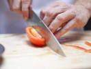 Cooking Class - Simply Greek: Chef slicing tomato