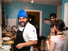 Cooking Class - Coastal Italian Cooking From Scratch: Chef smiling and engaging with two participants in a cozy kitchen during the Coastal Italian cooking class