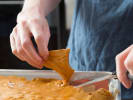 Cooking Class - Festive Candy Making in Carlsbad & Oceanside: Chef cutting salted peanut brittle into pieces