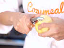 Cooking Class - Gourmet Fresh Pasta + Pasta Kit in Boulder: Chef peeling an apple with a vegetable peeler