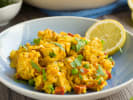 Cooking Class - Spanish Tapas and Traditional Paella in Northern Virginia: traditional chicken and chorizo paella garnished with lemon slices