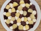 Team Building Cooking Class - French Pastry Bake-Off for Teams: Chocolate dessert decorated with piped cream and assorted white and dark chocolate toppings