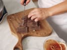 Cooking Class - Sophisticated Rack of Lamb Dinner in Philadelphia: Chocolate being chopped for the bittersweet chocolate and orange mousse