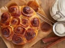 Cooking Class - Cozy Brunch Bites in Northern Suburbs: Cinnamon Roll Cake top view with cinnamon and icing sugar on the side