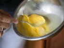 Cooking Class - Eggs Benedict With Finesse in Houston: Close up of hollandaise sauce being whisked in a metal bowl