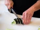 Cooking Class - Explore Japan in Fort Lauderdale: Cutting avocado cucumber sushi roll