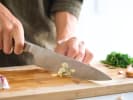 Cooking Class - Mediterranean Summer Delights in Downtown Dallas: Cutting garlic