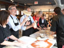 Cooking Class - Art of Pizza Making in Boston in Boston Proper: a group making pizza