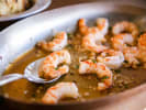Team Building Cooking Class - Spanish Tapas With an Asian Twist: Gambas al ajillo, Spanish garlic shrimp sizzling in olive oil with parsley in a skillet