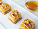 Cooking Class - Savory & Sweet Mediterranean Mezze: Golden baklava cups made with layered phyllo and walnuts, served with a side of honey for drizzling
