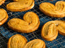 Cooking Class - Easy Puff Pastry From Scratch in Northern Suburbs: Golden palmier cookies displayed on a cooling rack